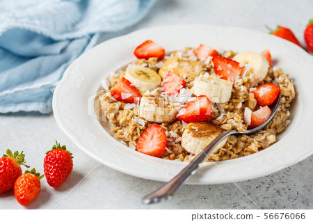 Oatmeal with banana, strawberries and peanut Oatmeal with banana, strawberries and peanut 56676066