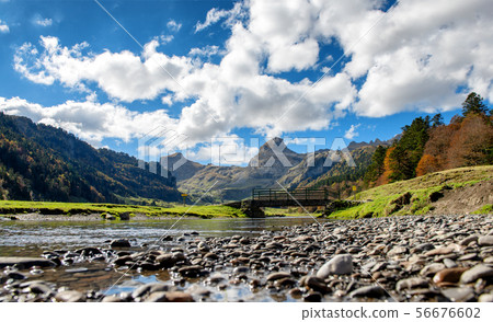 view of Pyrenees mountains with small river near view of Pyrenees mountains with small river near 56676602