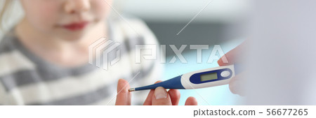 Female hand holding thermometer measuring sick little girl Female hand holding thermometer measuring sick little girl 56677265