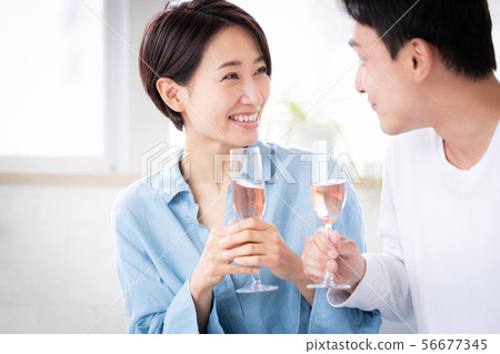 Surprise couple married couple giving present 56677345