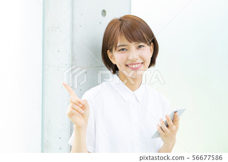 A college student operating a smartphone 56677586