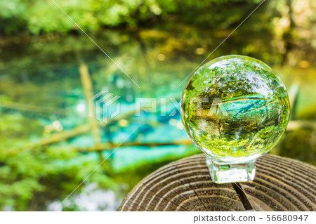 God's child pond peeking from a crystal ball (Kiyosato, Hokkaido) God's child pond peeking from a crystal ball (Kiyosato, Hokkaido) 56680947