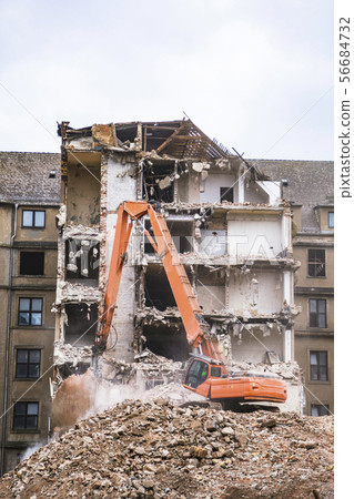 Old building demolition with hydraulic orange Old building demolition with hydraulic orange 56684732