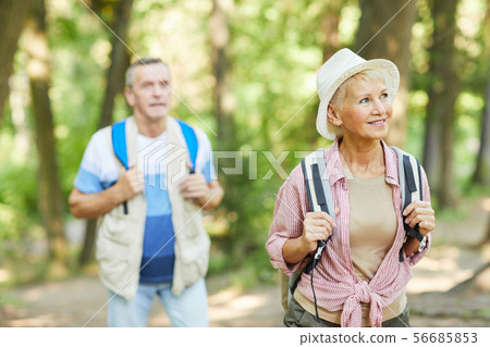 Couple of tourists going hiking Couple of tourists going hiking 56685853