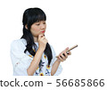 Cute Asian Girl Thinking while Using Mobile Phone 56685866