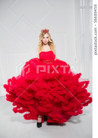 Pretty young blonde poses in a studio. Pretty young blonde poses in a studio. 56689459