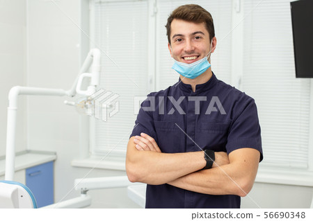 Dental polymerization lamp with UV light and laser. Stomatological instrument in the dentist clinic 56690348