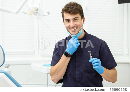 Dental polymerization lamp with UV light and laser. Stomatological instrument in the dentist clinic 56690368