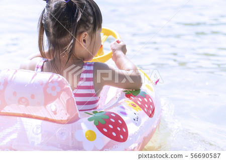 Children playing in the sea Children playing in the sea 56690587