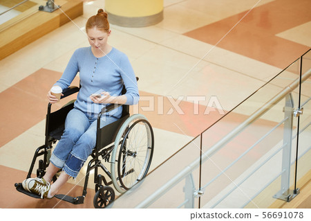 Disabled woman working on the phone 56691078