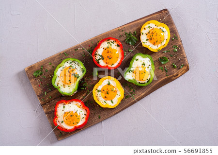 Yellow , red and green pepper with fried eggs 56691855
