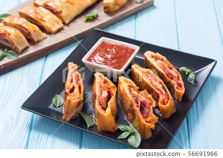 Pizza roll stromboli with cheese salami olives and Pizza roll stromboli with cheese salami olives and 56691966