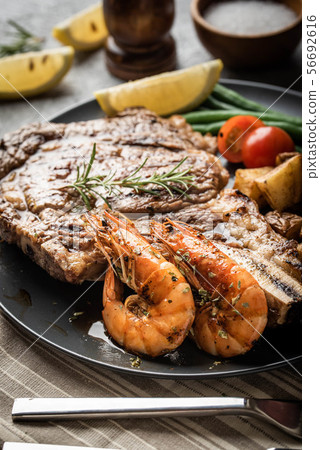 surf and turf, ribeye steak and grilled prawn surf and turf, ribeye steak and grilled prawn 56692616