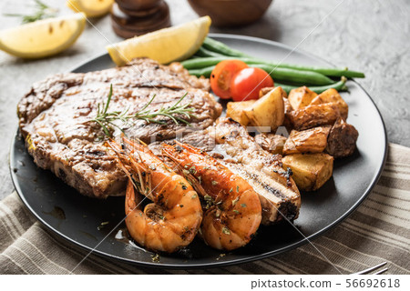 surf and turf, ribeye steak and grilled prawn surf and turf, ribeye steak and grilled prawn 56692618