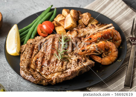 surf and turf, ribeye steak and grilled prawn surf and turf, ribeye steak and grilled prawn 56692619