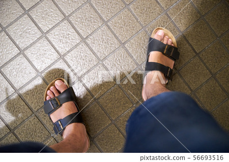 Tile floor / foot / sandals 56693516