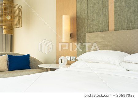 Beautiful comfortable pillow and blanket on bed decoration 56697052