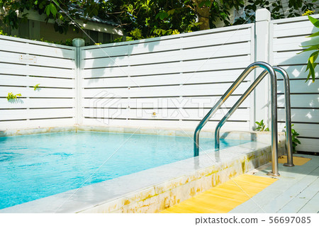 Beautiful outdoor swimming pool in hotel resort with stair 56697085