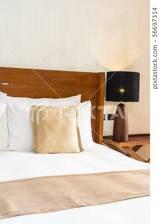 Beautiful comfortable luxury white pillow and blanket on bed decoration in bedroom Beautiful comfortable luxury white pillow and blanket on bed decoration in bedroom 56697314