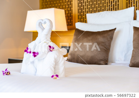 Beautiful elephant towel on bed decoration in bedroom interior Beautiful elephant towel on bed decoration in bedroom interior 56697322