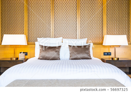 Beautiful luxury comfortable white pillow on bed and blanket decoration in bedroom Beautiful luxury comfortable white pillow on bed and blanket decoration in bedroom 56697325