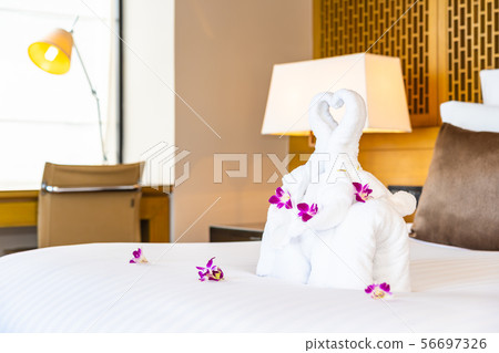 Beautiful elephant towel on bed decoration in bedroom interior 56697326