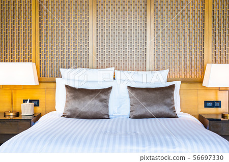 Beautiful luxury comfortable white pillow on bed and blanket decoration in bedroom Beautiful luxury comfortable white pillow on bed and blanket decoration in bedroom 56697330