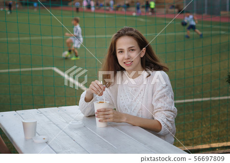 Student drinking coffee 56697809