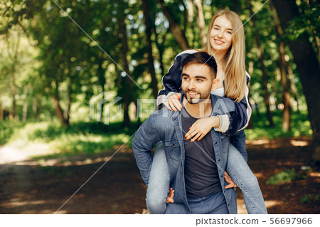 Beautiful couple spend time on a summer forest 56697966