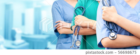 Doctor working in hospital with other doctors. 56698675