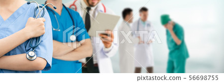 Doctor working in hospital with other doctors. 56698755