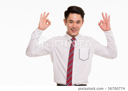 Asian businessman standing and thump up.. 56700774