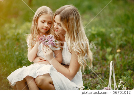 Cute and stylish family in a spring park 56701012