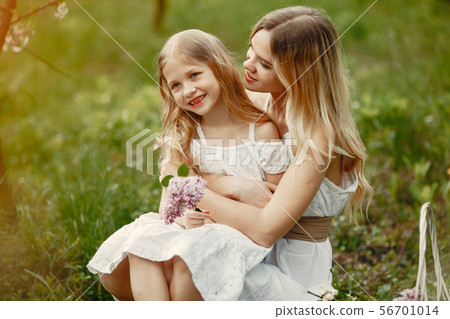 Cute and stylish family in a spring park 56701014