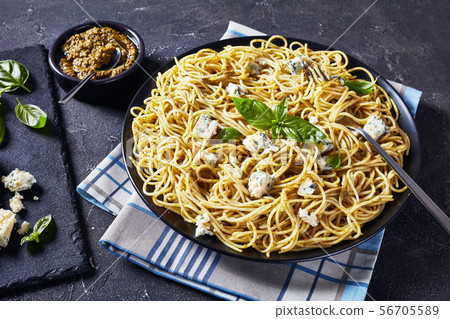 close-up of tasty Spaghetti with basil pesto 56705589