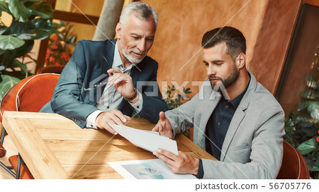 How can we improve it Businesspeople discussing new ideas during lunch break How can we improve it Businesspeople discussing new ideas during lunch break 56705776