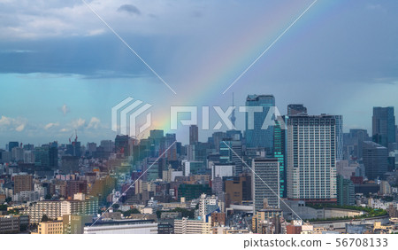 Tokyo cityscape in Japan towards Shibuya and rainbow (in the back is torrential rain) 56708133