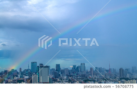 Tokyo cityscape in Japan Rainbow over Tokyo (in the back is a skyscraper standing in heavy rain) 56708775