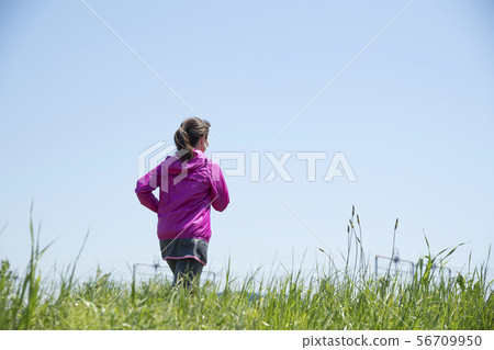 Woman running empty Woman running empty 56709950