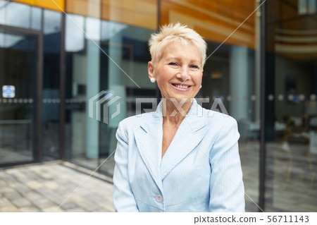 Successful mature businesswoman in the city 56711143