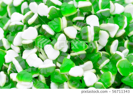 green and white gummy candy frog 56711343