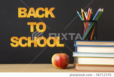 Education background with books, apple and stationery on black Education background with books, apple and stationery on black 56711570