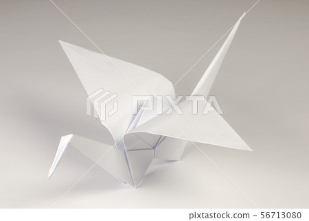 Light gray origami crane tsuru over gray Light gray origami crane tsuru over gray 56713080