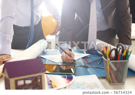 Architect Engineer Team Discussing Building Draft 56714324