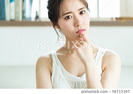 Young woman with a worried look Young woman with a worried look 56715307