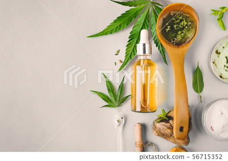Glass bottle and dropper CBD OIL, THC tincture and cannabis. Cosmetics CBD oil. 56715352