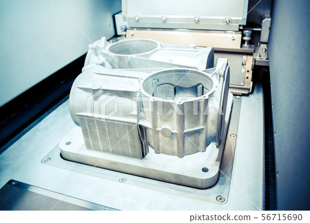 Model with supports created in laser sintering machine stays in working chamber Model with supports created in laser sintering machine stays in working chamber 56715690