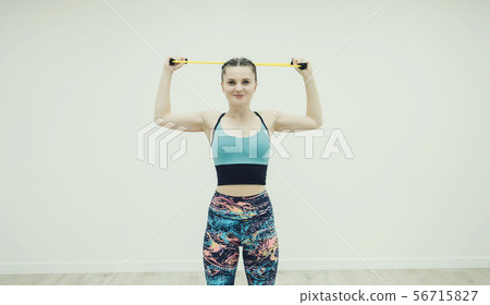Fitness woman doing exercises in gym Fitness woman doing exercises in gym 56715827