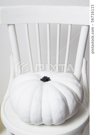 halloween pumpkin on a chair 56716115