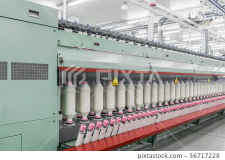 spools of thread at a textile factory 56717228